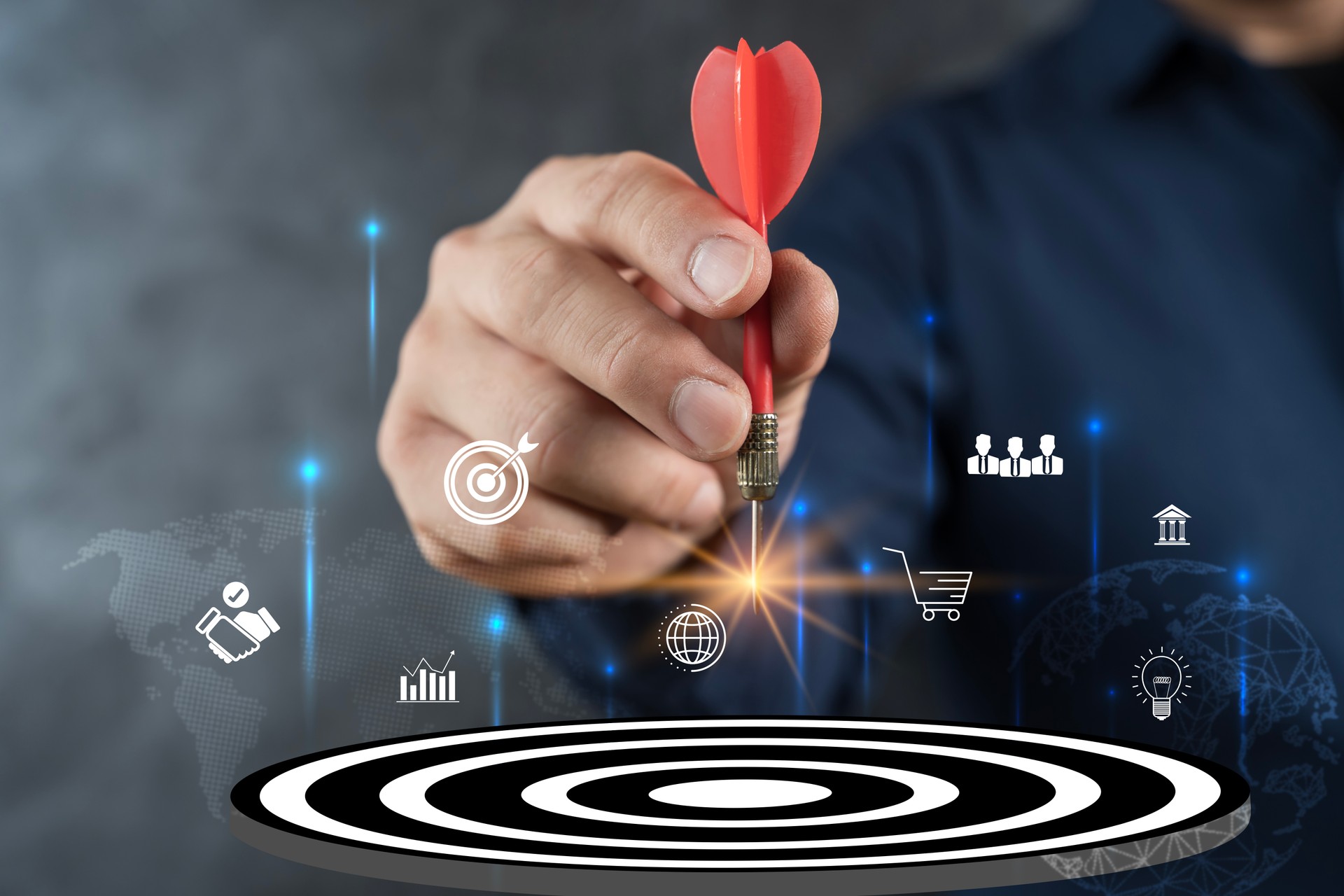 Targeting the business concept, Businessman hand holding red dart to the virtual target dartboard.